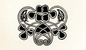 The open tailpiece is centered below the text. Drawn in a black outline, the tailpiece features four clovers, completely filled with black ink. Two of the clovers are centered at the top of the ornament, with their sides interlaced; the other two extend outwards on either side of the ornament. Two detailed leaves are on either side of the centered clovers. Stems extend from each of the clovers, all interlacing and ending in two spirals centered in the bottom of the ornament.-Y0s Database of Ornament