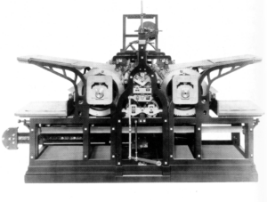 A black-and-white photograph of a steam printing press