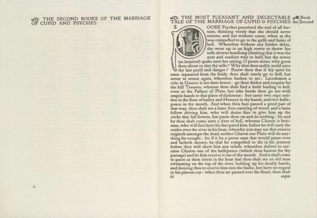 A two-page spread of a book, with an engraved ornamental first letter